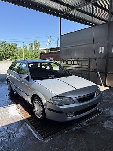 mercedesbenz 211: Mazda 323: 2000 г., Механика, Бензин, Универсал — 1