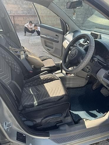 sm 5: Mazda Demio: 2004 г., Автомат, Бензин, Хэтчбэк — 5