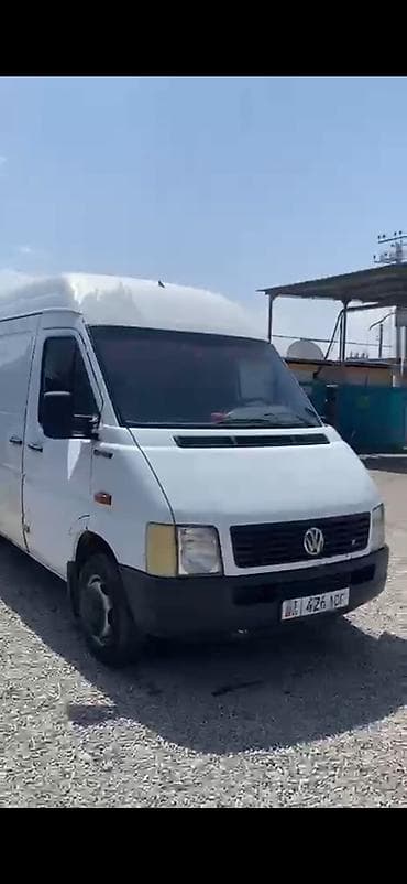 шлем с визором: Volkswagen LT длиннобазный, высокий кузов, белый фургон. Кузов: - — 3