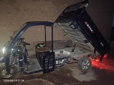Транспорт: Грузовой электротрицикл с самосвальным кузовом Описание: - — 3