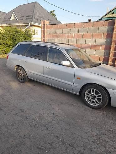 Mazda Familia: 2000 г., Механика, Бензин, Универсал — 3