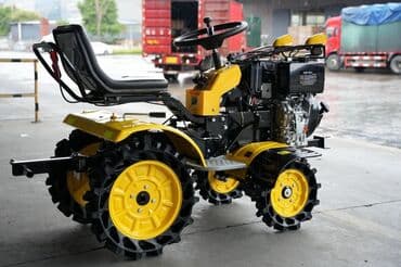 ищу работу тракторист: Мини-трактор желтого цвета с черными колесами. Предназначен для — 6