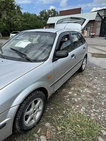 с люком: Mazda 323: 1999 г., Механика, Бензин, Хэтчбэк — 2