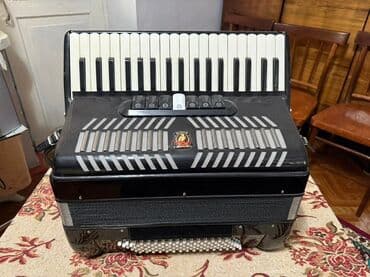 обучение фортепиано: Аккордеон Parrot (кнопочно-клавишный) Описание: - Корпус черного — 10