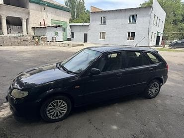 вампер 124: Mazda 323: 2001 г., 1.6 л, Механика, Бензин, Универсал — 2