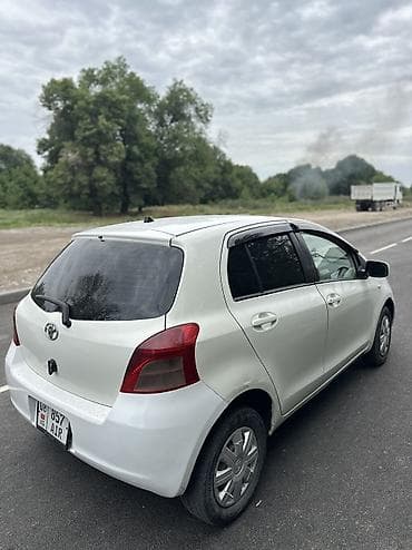 byd e7: Toyota Vitz: 2006 г., 1.3 л, Автомат, Бензин, Седан — 4