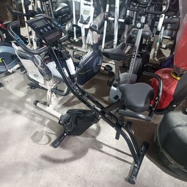 домашний велосипед тренажер: Велотренажер с регулируемым сиденьем и рулем, оснащенный электронным — 1