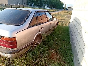 люк 124: Mazda 626: 1990 г., Хэтчбэк — 2