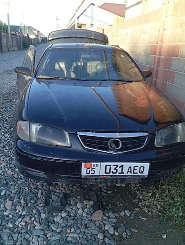 Mazda 626: 1999 г., 2.5 л, Механика, Бензин, Седан
