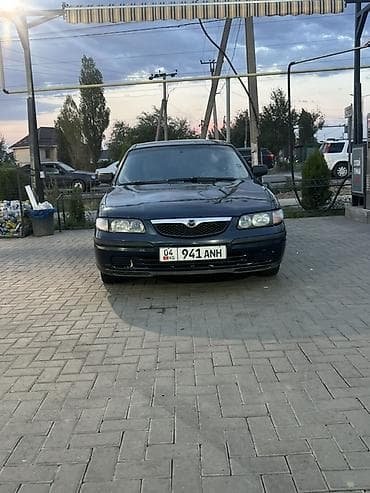 Унаа: Mazda 626: 1997 г., 1.8 л, Кол менен иштөөчү, Бензин, Седан — 2