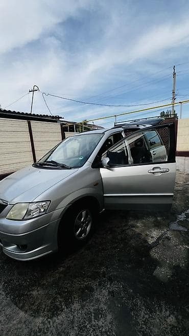 Транспорт: Mazda : 2003 г., Кол менен иштөөчү, Бензин — 2