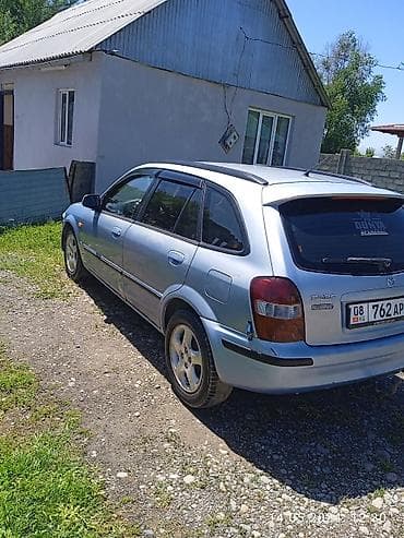 Транспорт: Mazda 323: 1999 г., Бензин, Универсал — 4