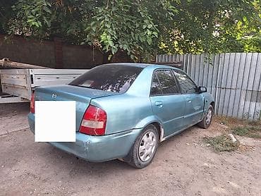 jac 9: Mazda 323: 2001 г., 1.6 л, Механика, Бензин, Седан — 2