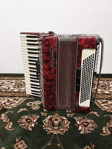 Аккордеон Weltmeister stella (Германия), красный перламутровый корпус