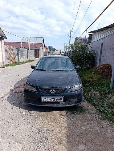Mazda 323: 2002 г., 1.6 л, Механика, Бензин, Универсал — 2