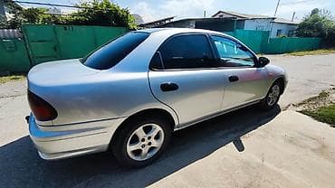 mini coper: Mazda 323: 1997 г., 1.5 л, Механика, Бензин, Седан — 3