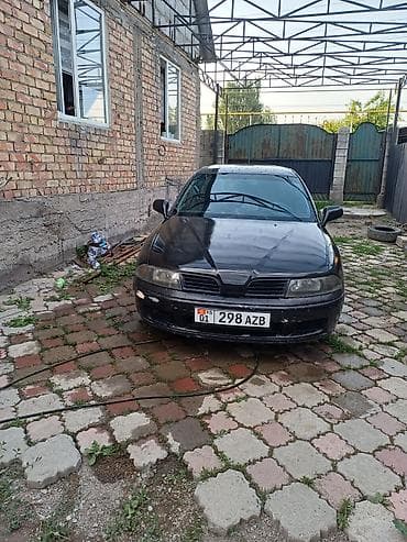 mazda cronos: Mitsubishi Carisma: 2002 г. — 1