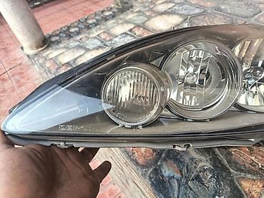 Башка унаа тетиктери: Алдыңкы оң фара Mazda — 2