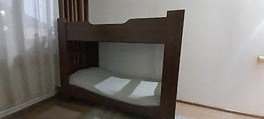 үй буйумдары: Двухъярусная кровать из ЛДСП (цвет — тёмный орех). Особенности: - — 2