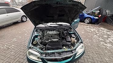 r18 255 55: Mazda 323: 2003 г., 1.6 л, Автомат, Бензин, Универсал — 9