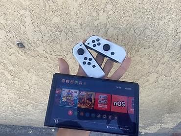 телефон редми 15 с: Игровая консоль Nintendo Switch OLED с белыми контроллерами Joy‑Con — 1