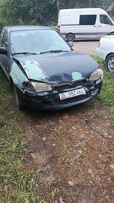 гранат мазда 323: Mazda 323: 1999 г., Седан — 1