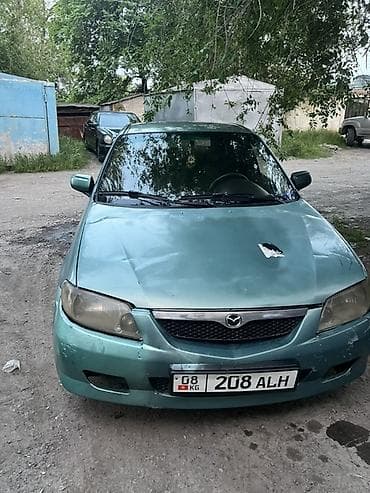 15 демио: Mazda 323: 2002 г., 1.6 л, Механика, Бензин, Хэтчбэк — 6