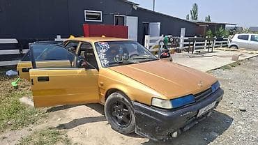 mini coper: Mazda 626: 1988 г., 0.2 л, Механика, Бензин, Хэтчбэк — 6