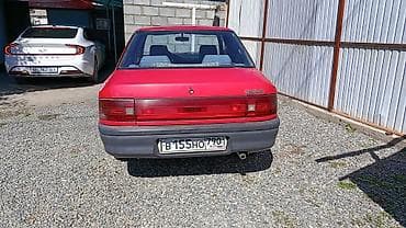 Продажа авто: Mazda 323: 1992 г., 1.3 л, Механика, Бензин, Седан — 1