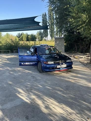 дамкрат авто: Mazda 323: 1992 г., Седан — 4