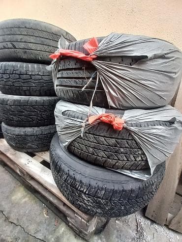 л 9: Комплект автомобильных шин (разные рисунки протектора). Описание: - — 1