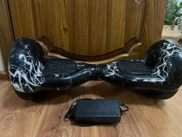 продаю настольный теннис: Гироскутер с Bluetooth, черный корпус с рисунком «молния». Колеса — 3