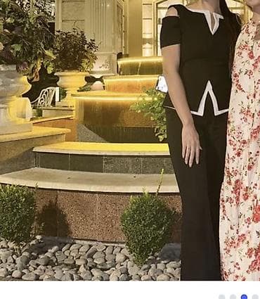 нижный беле: Элегантный женский комплект, состоящий из черного топа с открытыми — 1