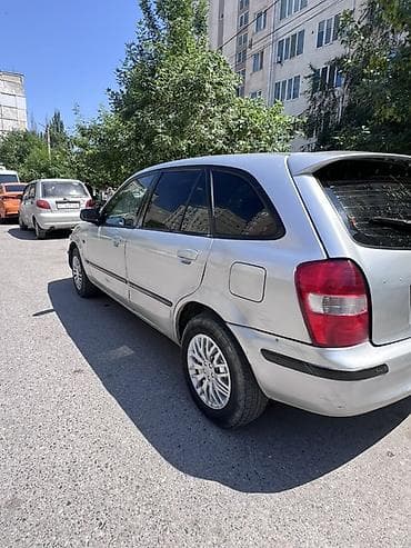 сузики вагон: Mazda 323: 2000 г., 1.6 л, Механика, Бензин, Универсал — 3