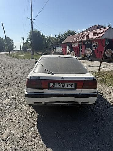 Унаа: Mazda 626: 1991 г., 2.2 л, Кол менен иштөөчү, Бензин, Хетчбек — 5