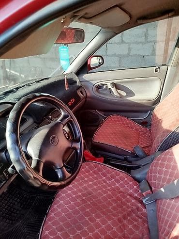 кирг шёлк: Mazda 323: 1995 г., Седан — 7