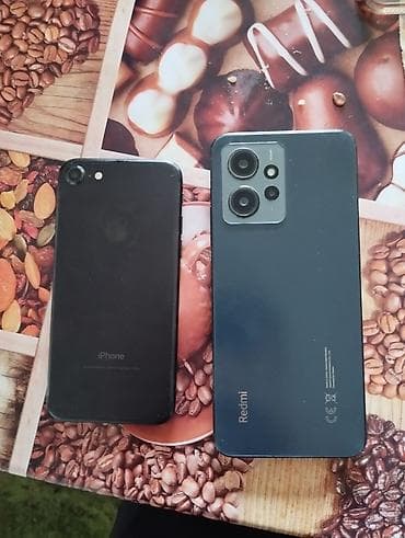 Мобильные телефоны и аксессуары: IPhone 7, Черный — 1