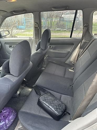 step vagon: Mazda Demio: 2003 г., 1.3 л, Ручные, Бензин, Универсал — 3