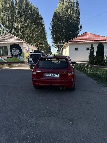 ваз 2112: Mazda 323: 1998 г., 1.5 л, Механика, Бензин, Хэтчбэк — 8