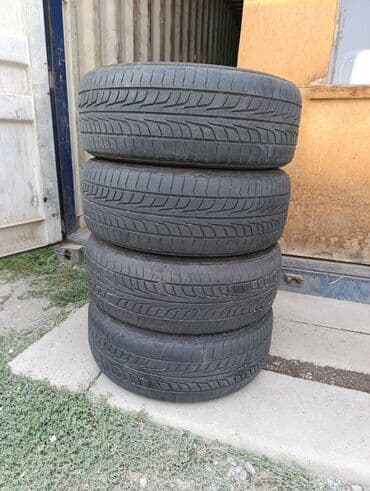 новые шыны: R-18 -215-45. Привозные из Японии. Шины летние комплект 4 шт. По нашим — 9