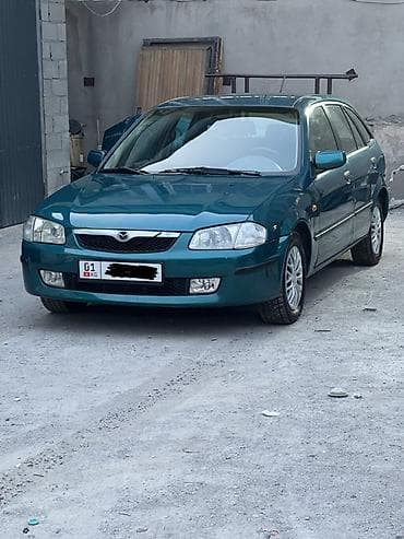 Mazda 323: 1999 г., 1.5 л, Автомат, Бензин, Хэтчбэк — 1