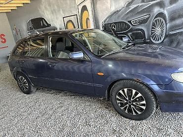 Унаа сатуу: Mazda 323: 2002 г., 2 л, Кол менен иштөөчү, Бензин, Хетчбек — 2
