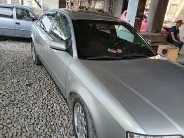 домкрат на ауди: Автомобиль Audi A6 серебристого цвета, представленный в кузове седан — 7