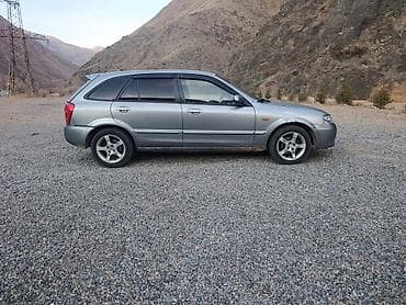 daf 480: Mazda 323: 2002 г., 1.6 л — 2