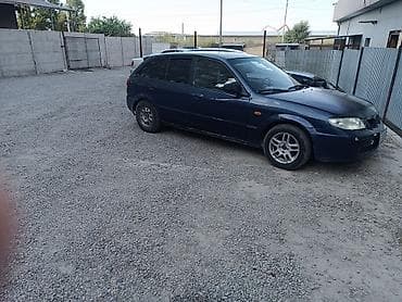 штамповый диски: Mazda Familia: 2001 г., Механика, Бензин, Универсал — 1