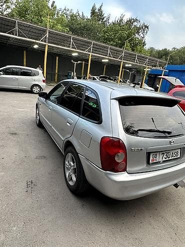 Mazda 323: 2004 г., Хэтчбэк — 9