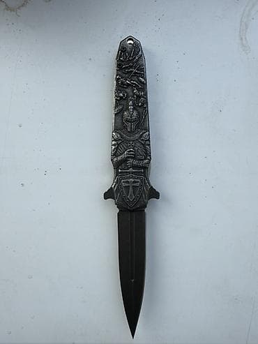 доллар: Декоративный кинжал-нож с тематикой средневековых рыцарей. - Материал — 5