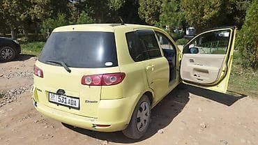 женский авто: Mazda Demio: 2004 г., 1.5 л, Автомат, Бензин, Хэтчбэк — 6