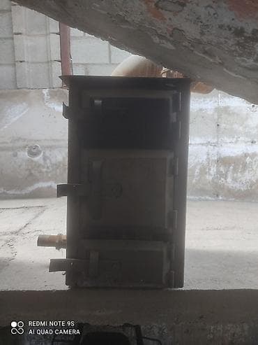 печки отопления: Металлическая твердотопливная печь с водяным контуром — 1