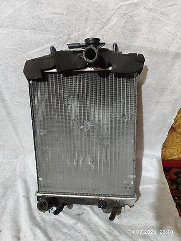 cuore: Радиатор охлаждения двигателя на Тойота Пассо, Дует. Daihatsu Cuore — 1